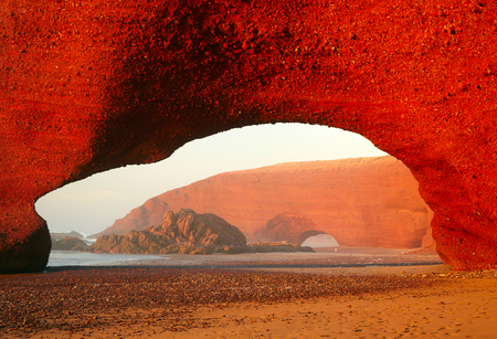 Red archs on atlantic ocean coast. Maroccoの写真素材