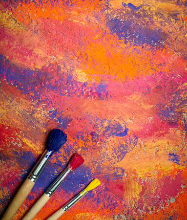 Paintbrushes on abstract grange の写真素材