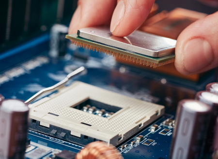 Plug in CPU microprocessor to motherboard socket. Technological backgroundの写真素材