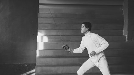 Young concentrated fencer man practice fencing exercises and trainingの写真素材