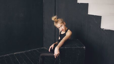 Modern beautiful teenage girl dancer perfomance contemporary dance in ballroom indoorsの写真素材