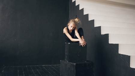 Modern beautiful teenage girl dancer perfomance contemporary dance in ballroom indoorsの写真素材