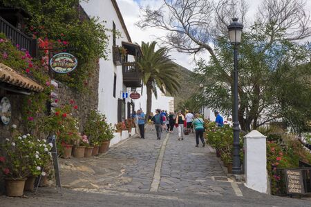 Tourists walking down a street in  Betancuria Fuerteventura Canary islands Las palmas Spainのeditorial素材