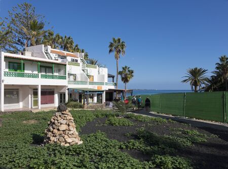 Seafront cafe Corralejo with stone pile Canary islands;  Fuerteventura; Spainのeditorial素材