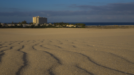 Sand pattern, Riu Hotel in the background, Park Natural, Corralejo, Fuerteventura, Canary islandsの写真素材