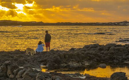 Sunset with dramatic colourful colorful sky in El Cotillo Fuerteventura Canary Islands Spainの写真素材