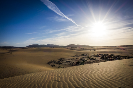 sunset with sand patterns after wind and rain on the Nature reserve, Park Natural, Corralejo, Fuerteventura, Canary Islands, Spain.の写真素材