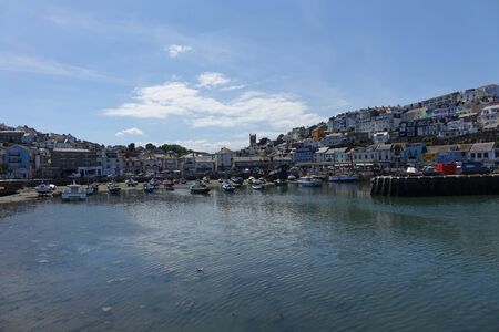 Beautiful Brixham harbour landscape in early afternoon in the middle of a hot bright summerの写真素材