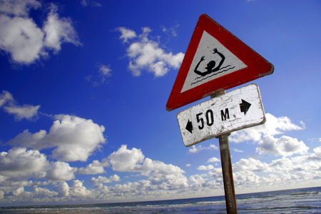 warning sign at the beachの写真素材