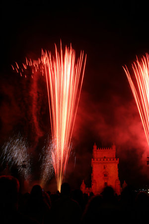 new year fireworks in the night in lisbon near tower belem, portugal
