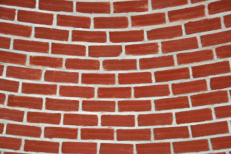 background textured of a round brick wall の写真素材