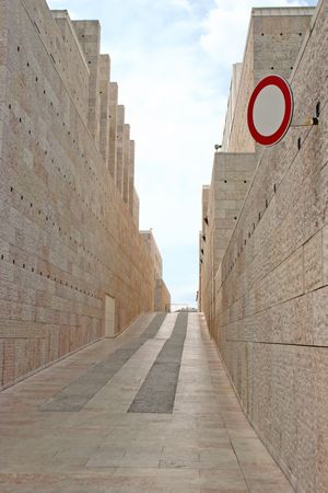 way between stone walls culture center in lisbonの写真素材