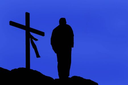 man praying in mountain near a cross - religious places - illustrationの写真素材