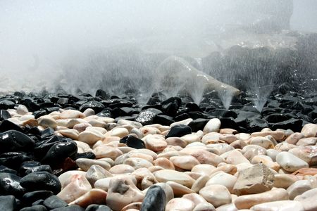 fountain detail, pink, white and black round stonesの写真素材