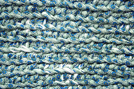 textile textured background in blue tones in graphic lines