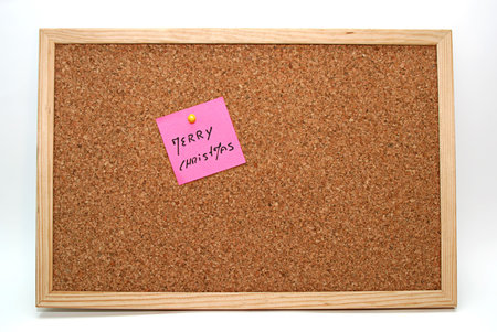 cork board with pink note の写真素材