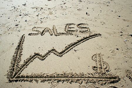 Sales graphic draw in the sand - business symbolsの写真素材