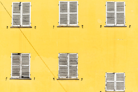 Windows asymmetry in white and yellowの写真素材