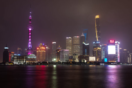 February 2019, Shangahi. Panorama of the city from the Bund on a rainy evening