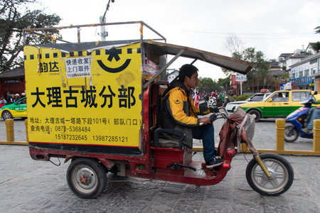 DALI, CHINA. February 2019. Person driving his own means of transportのeditorial素材