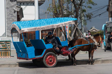 DALI, CHINA. February 2019. Person driving his own means of transportのeditorial素材