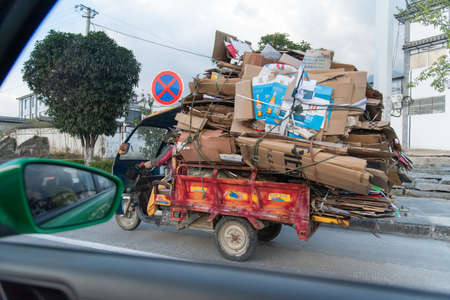 DALI, CHINA. February 2019. Person driving his own means of transportのeditorial素材