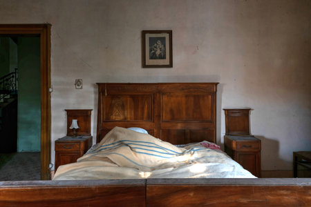 Italy, January 20, 2021. Bedroom in an abandoned country villaのeditorial素材