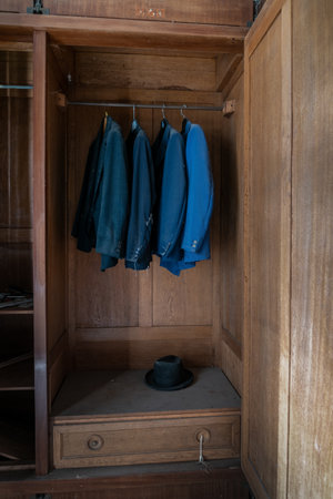 Italy, January 20, 2021. Wardrobe with hanging items in an abandoned country villaのeditorial素材
