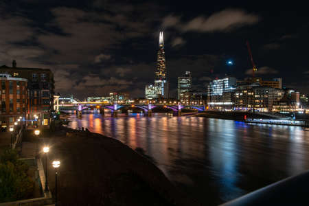 breathtaking panorama The Shard and Southwark Bridge at night in London, United Kingdom. long expositionのeditorial素材