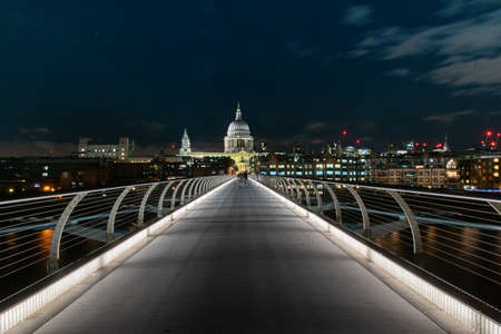 St Paul's Cathedral and Millennium Bridge over the River Thames in Londonのeditorial素材