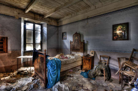 Italy, September 2022. Bedroom of an abandoned houseの写真素材