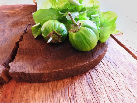 Organic vegetables, fresh jil? and lettuce on rustic wooden tableの写真素材