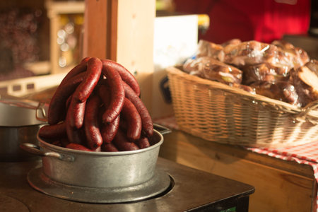 Pile of big red sausages in metal pan at christmas market, Zurich, Switzerland.の写真素材