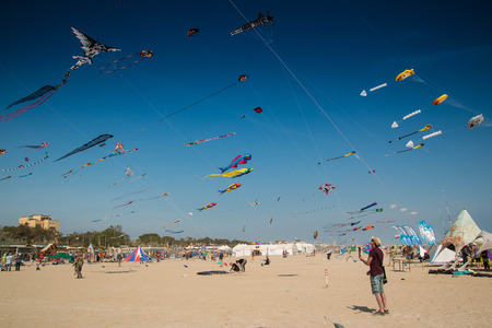 Many colorful kites in different shapes on the beach at Cervia international kite festivalのeditorial素材