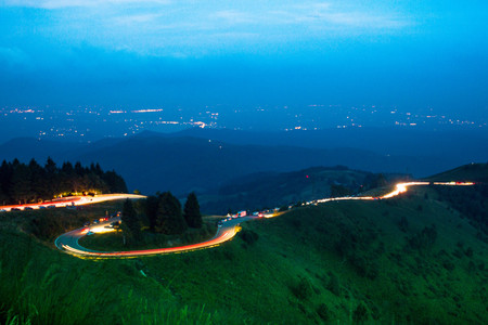 cars light trails on a mountain road, shoot on Mottarone mountain, Piedmont, Italy.の写真素材