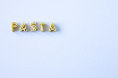The word "pasta" written with pasta on a white backgroundの写真素材