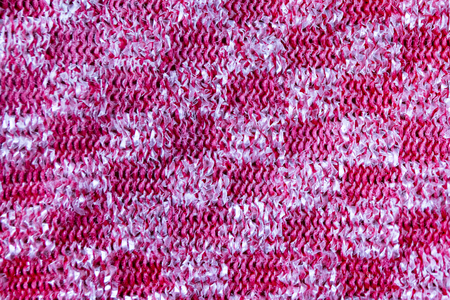Close up pattern of a red and silver metal scourer.の写真素材