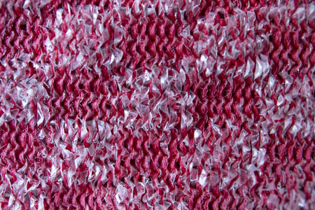Close up pattern of a red and silver metal scourer.の写真素材