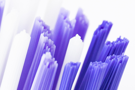 macro shot of blue and white toothbrush bristles.の写真素材