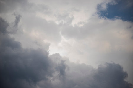 Grey and white stormy clouds. Heavenly or weather background or wallpaper.