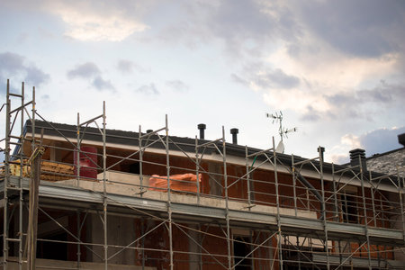 Civil construction site with scaffolds. Building sector background or wallpaper.