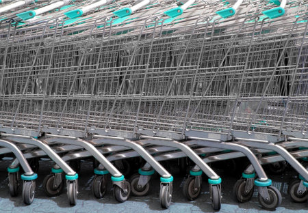 Row of supermarket shopping cart trolleys