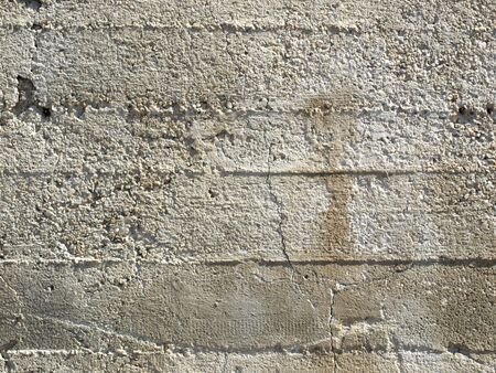 Detail of a raw reinforced concrete wall backgroundの写真素材