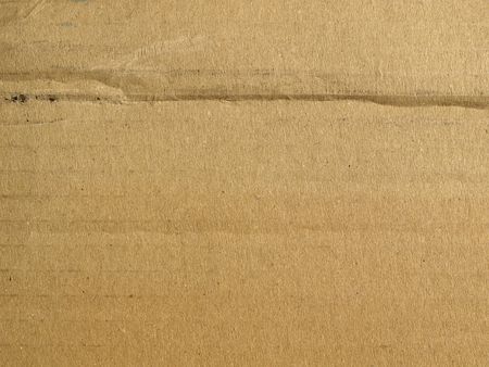 Brown grunge corrugated cardboard sheet useful as a backgroundの写真素材