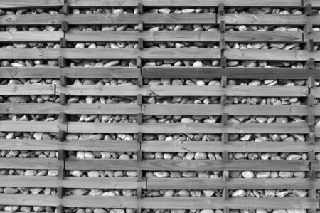 A stones wall with a wooden structureの写真素材