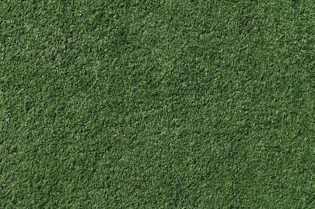 Green artificial grass lawn meadow useful as a backgroundの写真素材