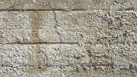 Detail of a raw reinforced concrete wall backgroundの写真素材