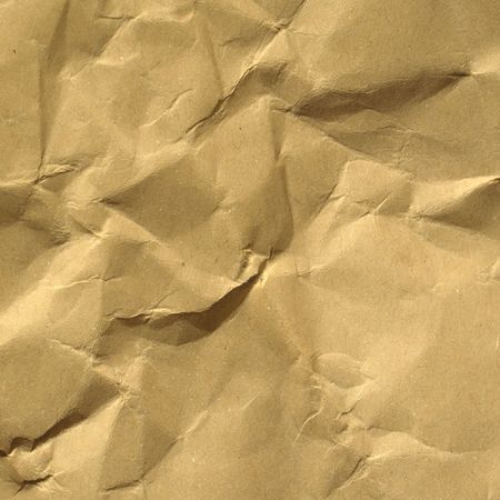 Sheet of brown and rippled paper backgroundの写真素材