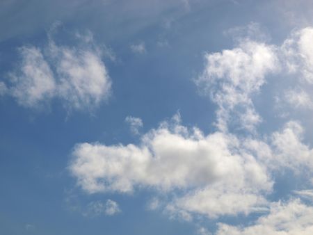 Blue sky with white clouds useful as a backgroundの写真素材