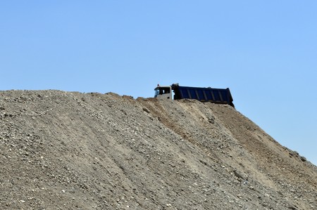 Truck on top of an earth moundの写真素材
